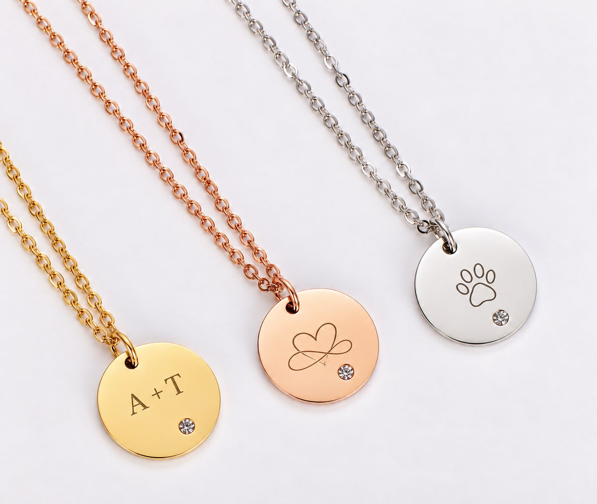 Engraved coin necklaces in silver, gold, and rose gold